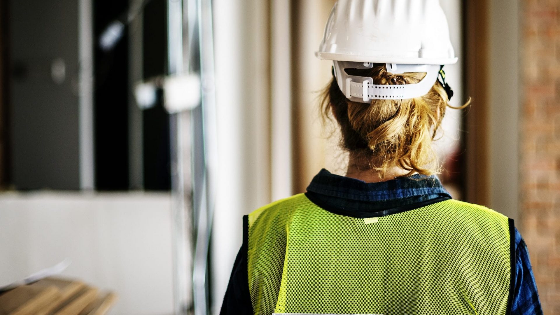 Woman constructor wearing security clothing